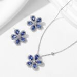 Wholesale High-End Micro Inlaid Zircon Sunflower Jewelry Set, featuring brilliant micro-set zircon gemstones, white gold plated copper, elegant sunflower stud earrings, and a matching luxury choker necklace, a premium set from junejewelry.com.