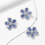 Wholesale High-End Micro Inlaid Zircon Sunflower Jewelry Set, featuring brilliant micro-set zircon gemstones, white gold plated copper, elegant sunflower stud earrings, and a matching luxury choker necklace, a premium set from junejewelry.com.