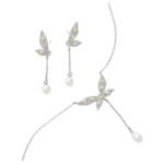 Wholesale Butterfly Tassel Pearl CZ Set in a platinum-plated finish on a black display bust. Features a matching necklace and drop earrings, both in a delicate butterfly shape with paved wings, ending in an elegant pearl tassel/drop.
