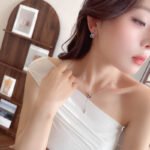 Wholesale Purple Zircon Gourd Prosperity Set (Hulu shape), featuring copper plated with white gold, vibrant micro-pave purple zircon stones, gourd stud earrings, and a simple versatile neck chain, a light luxury set for spring/summer from junejewelry.com.