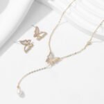 Mother of Pearl Butterfly Lariat Necklace Set shown in both gold and silver finishes. The set includes a Y-necklace with an MOP butterfly and pearl drop, and matching MOP butterfly stud earrings.