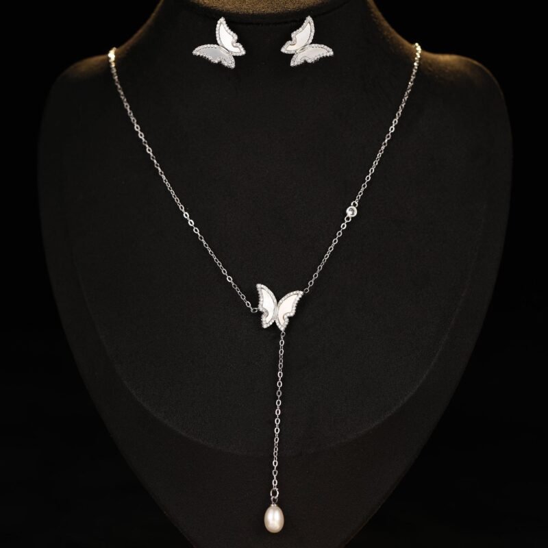 Mother of Pearl Butterfly Lariat Necklace Set shown in both gold and silver finishes. The set includes a Y-necklace with an MOP butterfly and pearl drop, and matching MOP butterfly stud earrings.