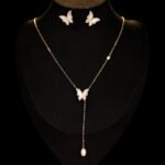 Mother of Pearl Butterfly Lariat Necklace Set shown in both gold and silver finishes. The set includes a Y-necklace with an MOP butterfly and pearl drop, and matching MOP butterfly stud earrings.
