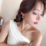 Wholesale Simple Baguette Pearl Set on a white background, featuring a necklace and drop earrings. Both pieces showcase a round dark gray pearl suspended from a rectangular bail fully paved with Baguette-Cut Cubic Zirconia.