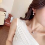 Wholesale Simple Baguette Pearl Set on a white background, featuring a necklace and drop earrings. Both pieces showcase a round dark gray pearl suspended from a rectangular bail fully paved with Baguette-Cut Cubic Zirconia.