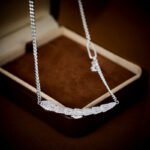 Wholesale Zircon Snake Jewelry Set, featuring high-quality zircon stones, white gold plated copper, a unique serpent design choker necklace, matching snake earrings, and a ring, a light luxury set from junejewelry.com.