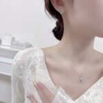 Vintage ruby jewelry set wholesale – red oval ruby pendant necklace and matching earrings in French royal floral design, white gold plated.