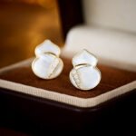 Mother of Pearl Gourd Necklace and Earrings Set in gold plating. The jewelry features a lucky gourd shape made of MOP shell with a CZ accent line across the center.