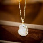 Mother of Pearl Gourd Necklace and Earrings Set in gold plating. The jewelry features a lucky gourd shape made of MOP shell with a CZ accent line across the center.