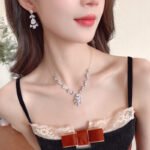 Wholesale Light Luxury Bridal Zircon Necklace Set, featuring a high-end design with brilliant zircon stones and copper settings, perfect wedding accessories for pairing with a formal gown, available in ready stock.