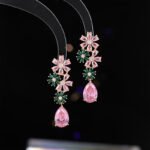 Wholesale Pink Green Floral Jewelry Set featuring pink and green micro-inlaid zircon flower clusters and elegant pink teardrop dangle. 18K gold plated copper accessories from JuneJewelry.com.