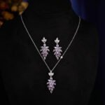 Wholesale leaf jewelry set with sparkling cubic zirconia necklace and earrings in white gold plated copper from JuneJewelry.com – elegant luxury jewelry for bulk buyers.