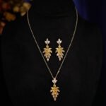 Wholesale leaf jewelry set with sparkling cubic zirconia necklace and earrings in white gold plated copper from JuneJewelry.com – elegant luxury jewelry for bulk buyers.