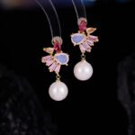 Wholesale Pink Cherry Blossom Jewelry Set on JuneJewelry.com: 18K gold plated copper necklace and earrings with micro-inlaid pink zircon stones, romantic and highly versatile design.