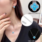 Wholesale Light Luxury Lucky Clover Turquoise Blue Set, featuring the four-leaf clover motif inlaid with vibrant turquoise blue stones, includes matching niche design earrings and a high-end sense necklace, from junejewelry.com.