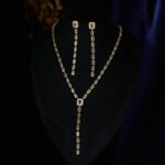 Wholesale Colorful Zircon Tassel Jewelry Set, featuring geometric square shapes, brilliant colorful micro-pave zircon gemstones, 18K real gold plated copper, a long tassel necklace, and matching drop earrings, a light luxury set from junejewelry.com.