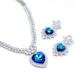 2-Piece Swarovski Element Jewelry Set with Marquise Cut CZ necklace and heart pendant, available in iridescent AB crystal and classic blue crystal colors.
