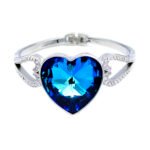 Wholesale Blue Heart Swarovski Element Bangle in gold plating, featuring micro-pavé CZ stones. Luxury crystal jewelry for bulk purchase.