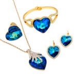 Wholesale Blue Teardrop Swarovski Element Jewelry Set, including pendant necklace and matching earrings, with gold plating.