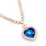 Wholesale Heart Crystal Necklace with blue heart pendant and crystal tennis chain in 18K gold plated brass from JuneJewelry.com – perfect for bulk fashion jewelry orders.