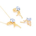 Wholesale abstract butterfly jewelry set with light blue Swarovski Elements crystal and 18K gold plated fluid-design necklace and stud earrings from JuneJewelry.com.