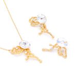 Wholesale abstract butterfly jewelry set with light blue Swarovski Elements crystal and 18K gold plated fluid-design necklace and stud earrings from JuneJewelry.com.