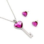 Wholesale key pendant jewelry set with fuchsia heart Swarovski Elements crystal and matching stud earrings – 18K white gold plated fashion jewelry from JuneJewelry.com.