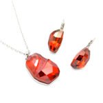 Wholesale irregular cut crystal jewelry set in deep red/amber Swarovski element with 18K Gold and White Gold plated brass from JuneJewelry.com.