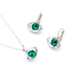 Wholesale Evil Eye jewelry set with blue and clear Swarovski Elements crystals on an 18K plated necklace and matching earrings from JuneJewelry.com.