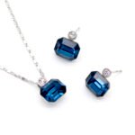 Collection of wholesale simple single stone crystal jewelry sets including round, oval, triangle, and square shapes in various colors and 18K gold/white gold plated finishes from JuneJewelry.com.