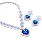 2-Piece Swarovski Element Jewelry Set with V-collar necklace and matching heart dangle earrings featuring multiple cascading teardrop crystals in blue.