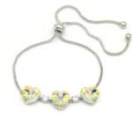 Wholesale Swarovski Element Halo Tennis Bracelet featuring brilliant heart stones framed by pave crystal halos. A luxurious, flexible link design.