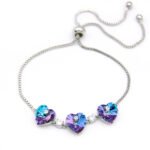 Wholesale Swarovski Element Halo Tennis Bracelet featuring brilliant heart stones framed by pave crystal halos. A luxurious, flexible link design.