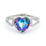 Swarovski Element heart bangle, showing the smooth metal band and the central heart feature fully covered in glittering crystals.