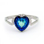 Swarovski Element heart bangle, showing the smooth metal band and the central heart feature fully covered in glittering crystals.
