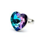 Swarovski Element adjustable heart crystal ring shown in three colors: iridescent golden yellow AB, dual-tone purple/blue AB, and deep sapphire blue, all featuring a large heart crystal.