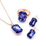 Wholesale pink crystal rectangular jewelry set in rose gold plating with a large faceted pink crystal ring, pendant, and matching drop earrings from JuneJewelry.com – unique and high-quality.