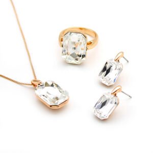 Wholesale pink crystal rectangular jewelry set in rose gold plating with a large faceted pink crystal ring, pendant, and matching drop earrings from JuneJewelry.com – unique and high-quality.