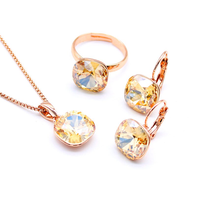 Wholesale Crystal Square Set in rose gold plating with a large faceted purple crystal pendant, drop earrings, and adjustable ring from JuneJewelry.com – unique and high-quality.