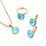 Wholesale Crystal Square Set in rose gold plating with a large faceted purple crystal pendant, drop earrings, and adjustable ring from JuneJewelry.com – unique and high-quality.