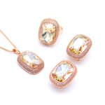 Wholesale crystal pave jewelry set in rose gold plating with a large rectangular smoky grey crystal ring, pendant, and matching stud earrings from JuneJewelry.com – unique and high-quality.