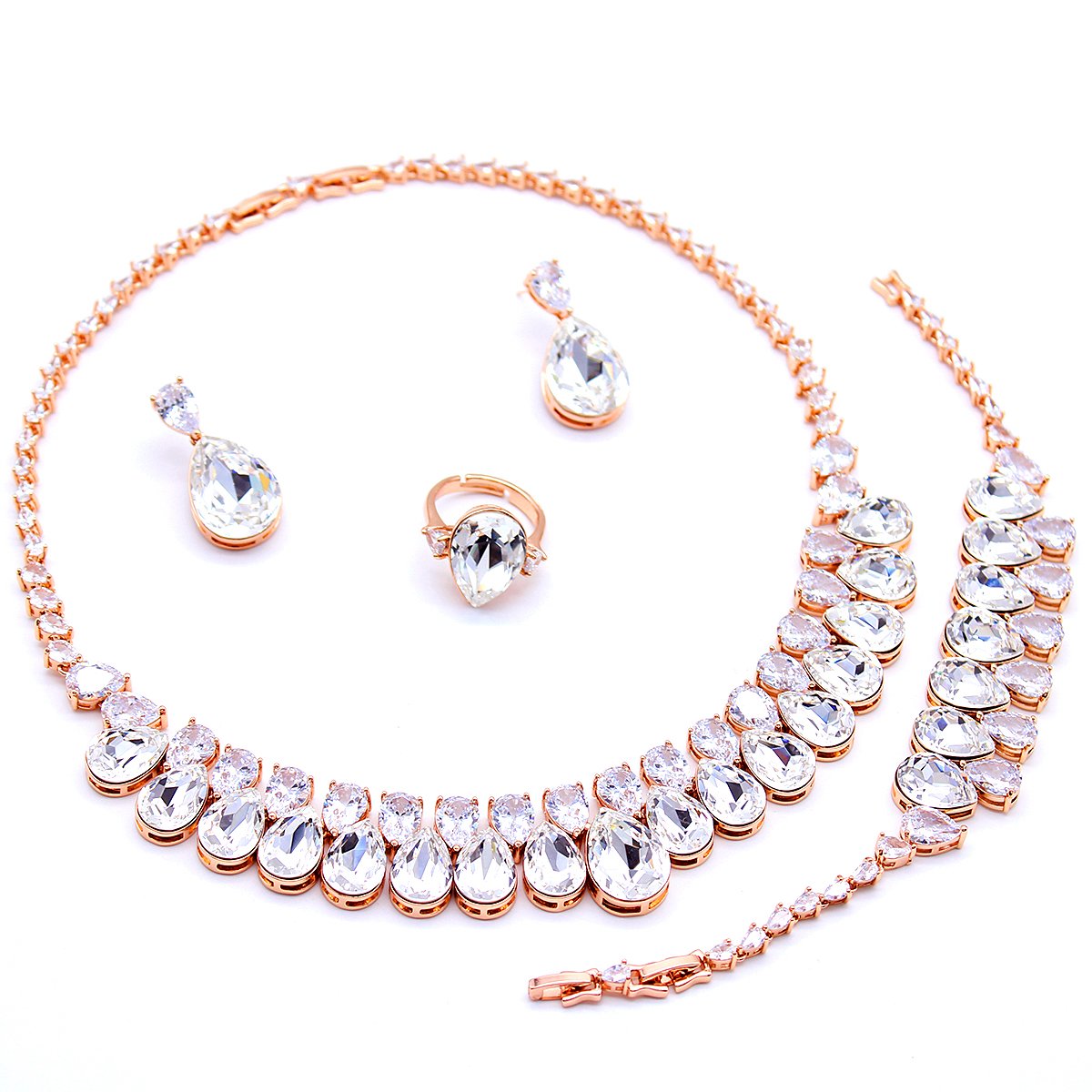 K301104A-006.768.A Wholesale Pear Crystal Drop Jewelry Set with rose gold plating, clear pear-shaped crystals – necklace, bracelet, earrings, and ring from JuneJewelry.com factory price.
