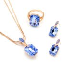 Wholesale clear crystal rectangular jewelry set in rose gold plating with a large faceted white crystal ring, pendant, and matching drop earrings from JuneJewelry.com – unique and high-quality.
