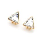 A pair of Swarovski Element stud earrings, showing a close-up of the single, glittering triangle-cut crystal set in a simple three or four-prong stud mounting.