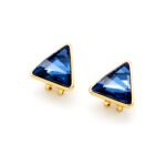 A pair of Swarovski Element stud earrings, showing a close-up of the single, glittering triangle-cut crystal set in a simple three or four-prong stud mounting.
