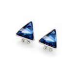 A pair of Swarovski Element stud earrings, showing a close-up of the single, glittering triangle-cut crystal set in a simple three or four-prong stud mounting.