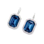 Professional shot of a pair of leverback earrings featuring a single, large octagon-cut Swarovski element crystal in a classic prong setting.