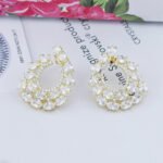 Wholesale open teardrop earrings with oval cubic zirconia on real gold plated brass and 925 silver pins from JuneJewelry.com.