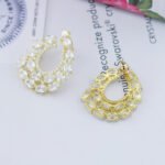 Wholesale open teardrop earrings with oval cubic zirconia on real gold plated brass and 925 silver pins from JuneJewelry.com.