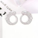 Wholesale pavé hoop earrings with micro-zircon and large crystals on gold plated copper from JuneJewelry.com – premium fashion jewelry for bulk buyers.